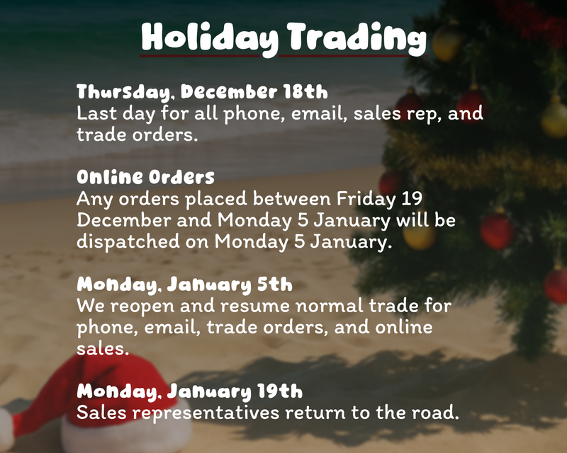Christmas tree on a beach with holiday trading information text overlay